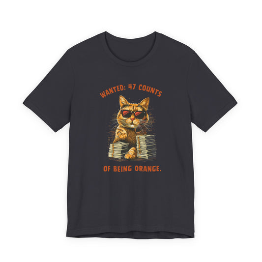 Black t-shirt with orange cat wearing sunglasses and stacks of cash, text Wanted: 47 Counts of Being Orange