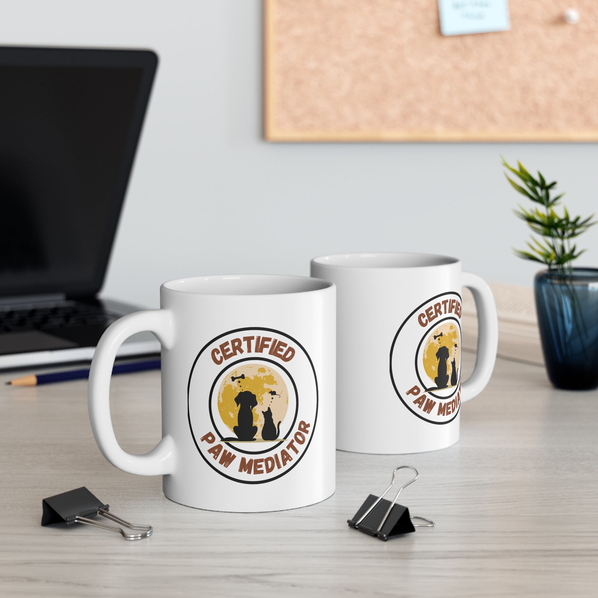 White mug with 'Certified Paw Mediator' design on a wooden table.11oz Coffee Mug
Funny Coffee Cup
Pet Humor Mug
Pet Lover Merch
Animal Themed Gifts
Cute Pet Merch
Coffee Mug Gift
Funny Pet MugPet Parent
Animal Lover
Multi Cat Household
Cat Lover Gifts
Pet Lover Gifts