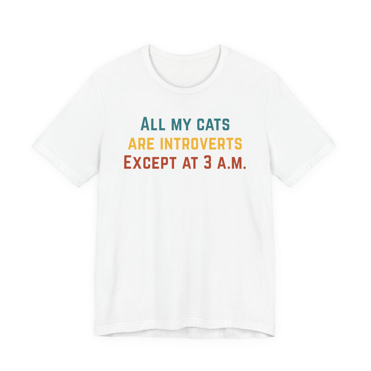 White t-shirt displaying the phrase 'All my cats are introverts except at 3 A.M.' in vibrant colors.