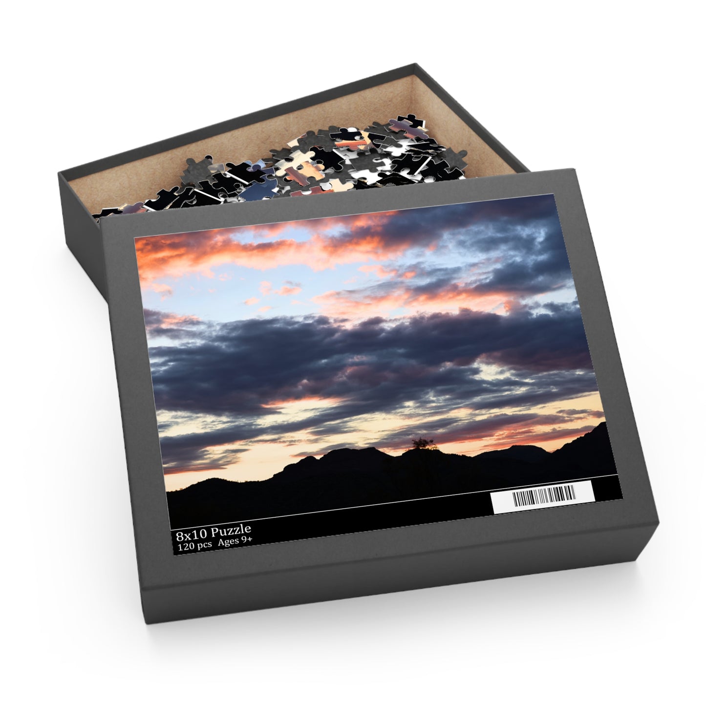 Jigsaw puzzle box with a sunrise landscape design on the lid