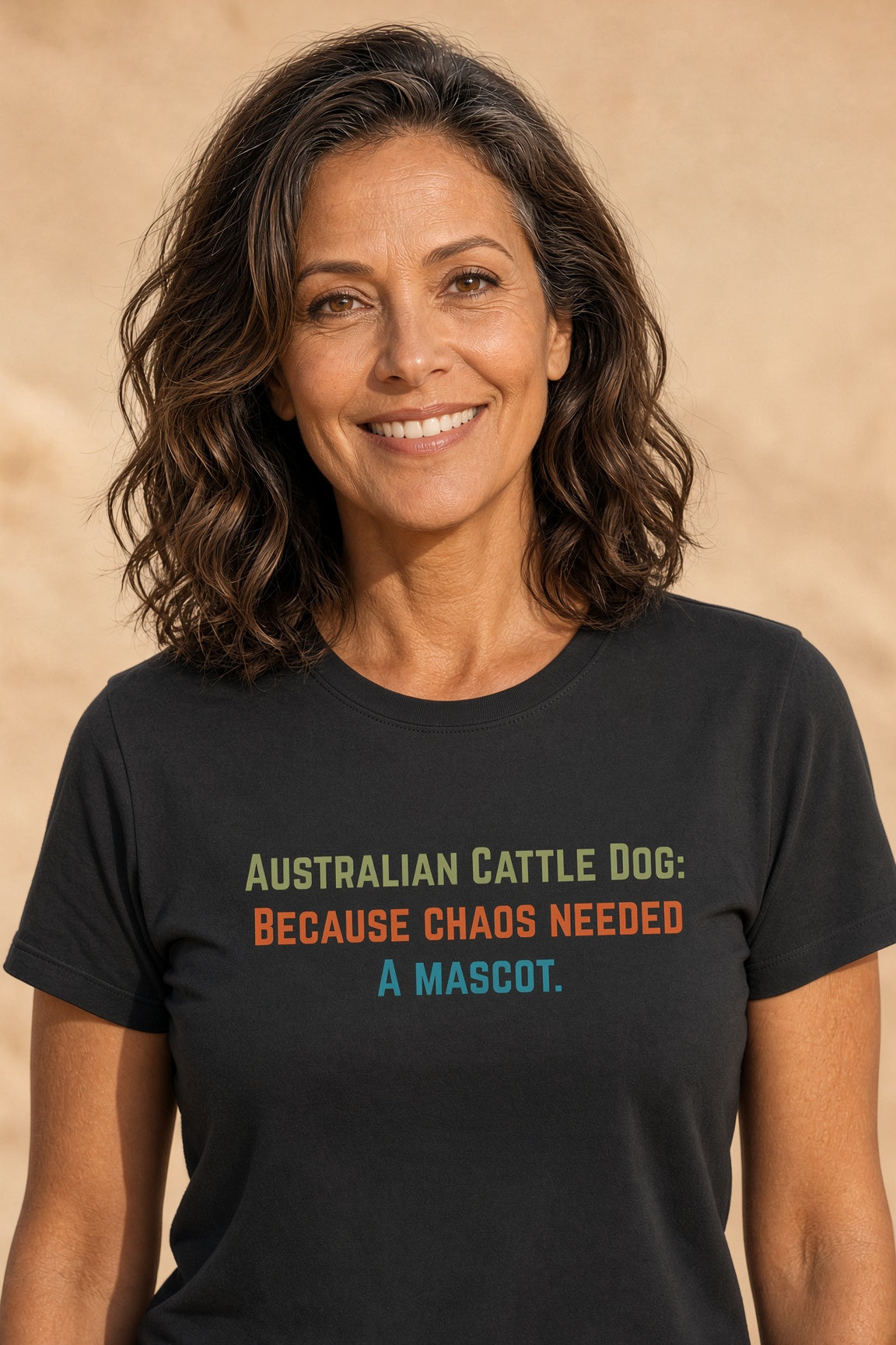 Woman wearing a black t-shirt with text: Australian Cattle Dog: Because chaos needed a mascot.