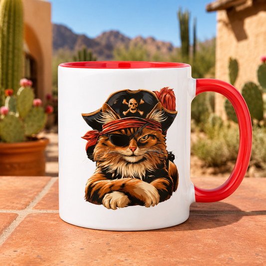 White mug with a pirate cat design, featuring a red handle and rim, set against a desert background.