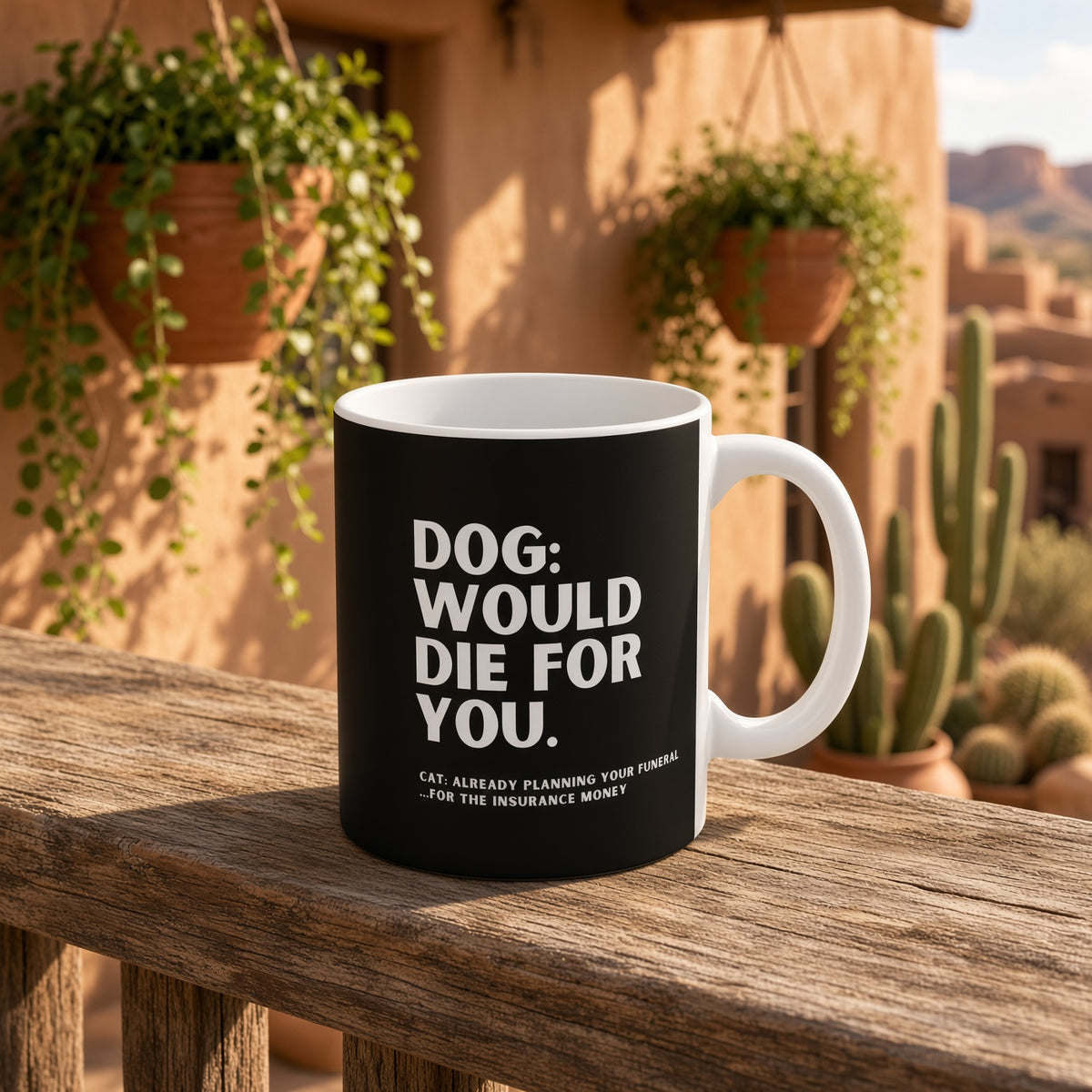 Mug with dog vs cat humor placed on a wooden railing with greenery