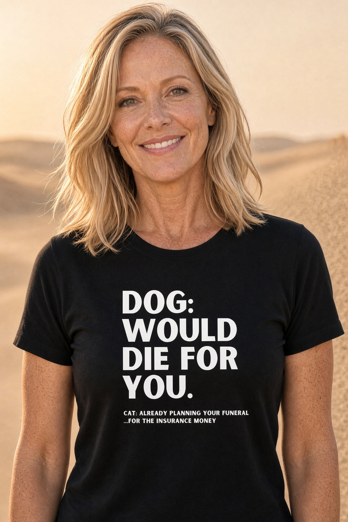 Woman smiling while wearing a black t-shirt with humorous dog and cat text.