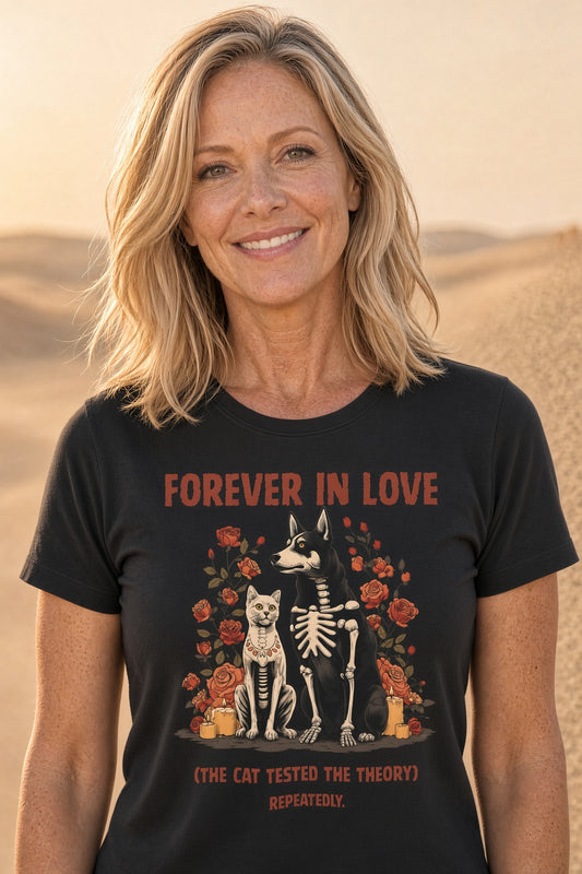 Woman wearing a black tee with skeleton dog and cat design, surrounded by roses with the text 'Forever In Love (The Cat Tested The Theory Repeatedly)'