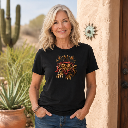 Woman wearing a black t-shirt with a pirate cat design, outdoors with cacti.