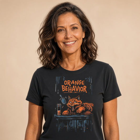 Woman wearing a black t-shirt featuring an orange tabby cat graphic with the text 'ORANGE BEHAVIOR'.