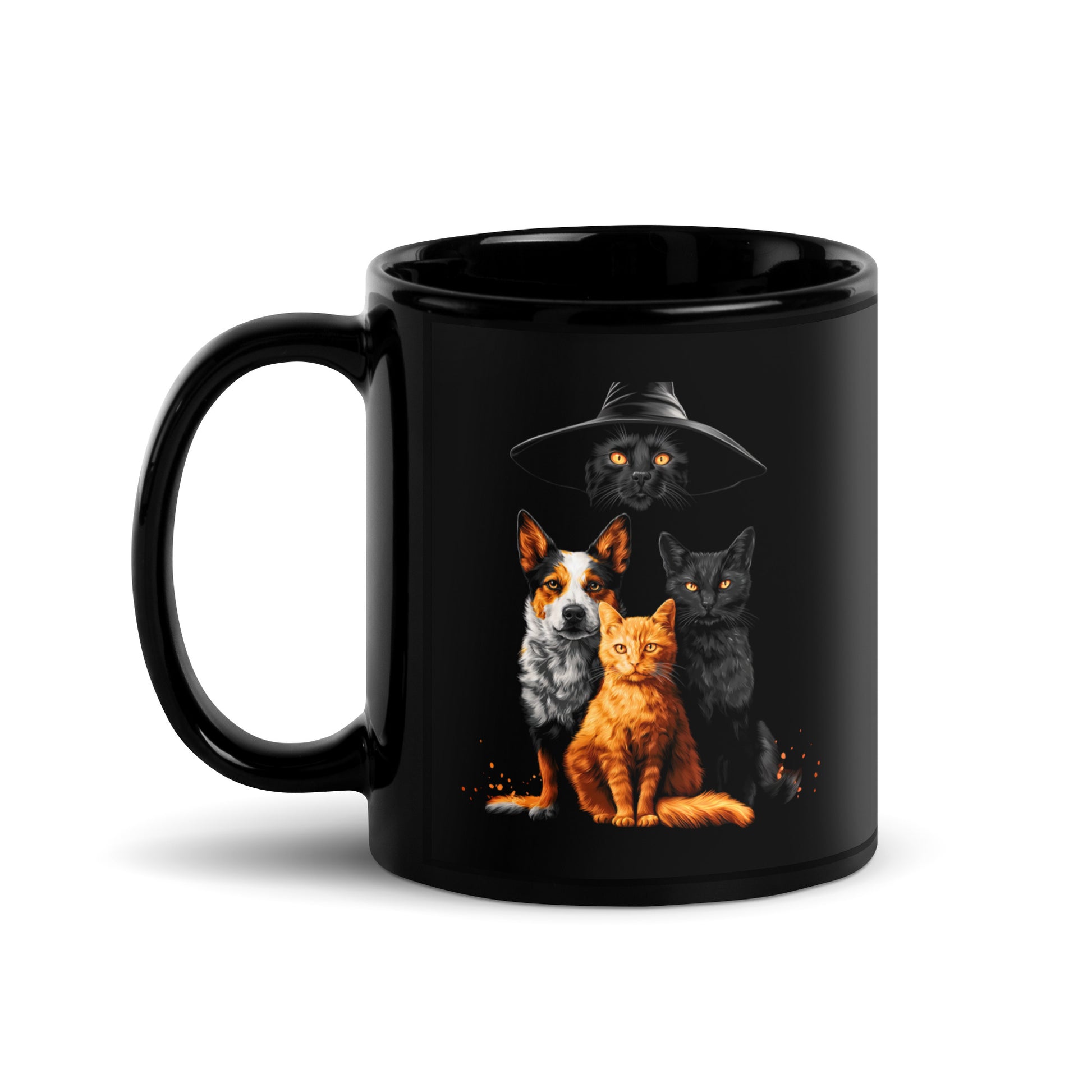 Black mug with a graphic of a black cat in a witch hat with a cattle dog, a black cat  and a orange cat.