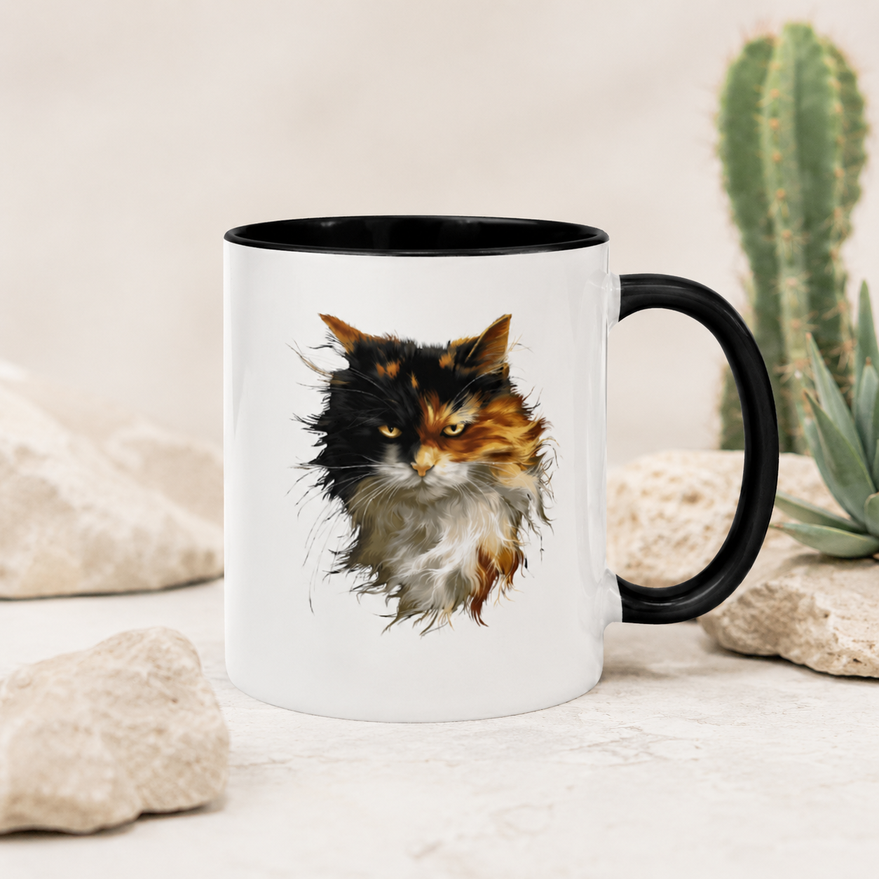 Close-up of fluffy calico cat portrait artwork on a ceramic coffee mug with black interior.