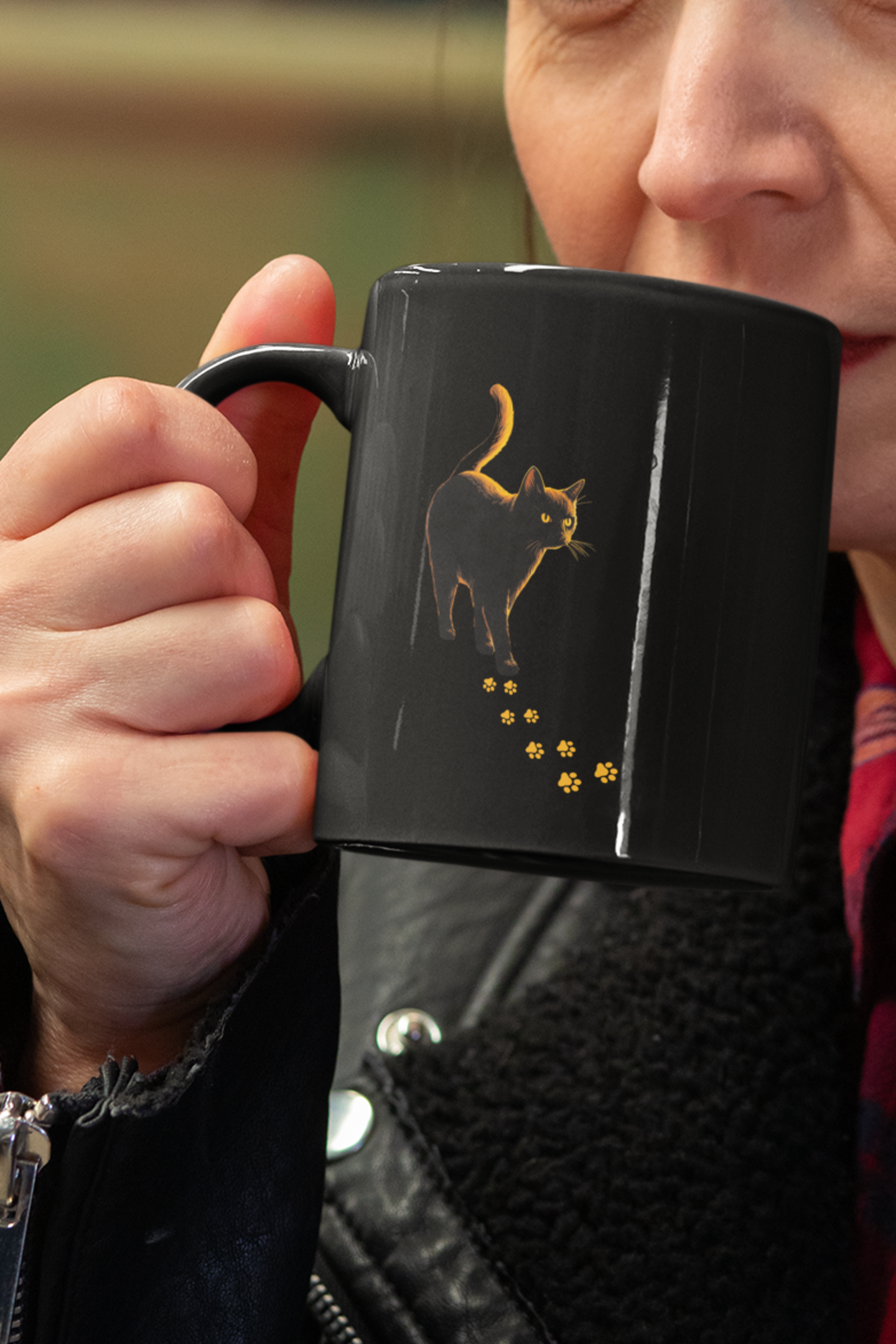 Black Cat Feral Knows All Mug | Glowing Amber Black Cat Mug with Paw Print Trail