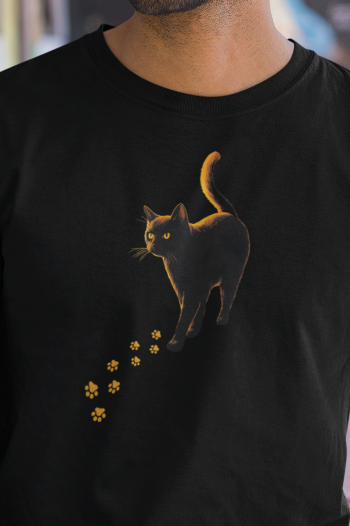 Black Cat Feral Knows All Tee Big Alibi witchy black cat shirt with glowing golden paw prints