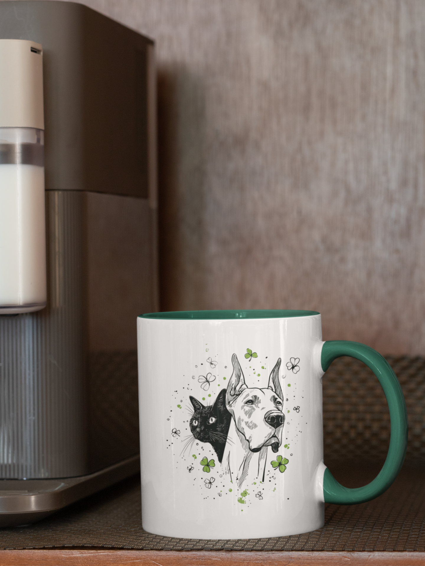 White mug with green handle and interior featuring ink sketch Great Dane and black cat with shamrocks.